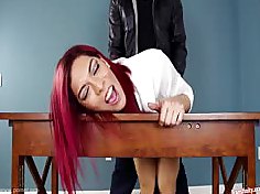 This redhaired shemale slut bent over the desk and fucked in the ass